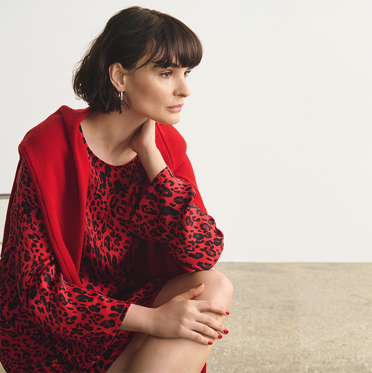 Woman in red dress with leopard print