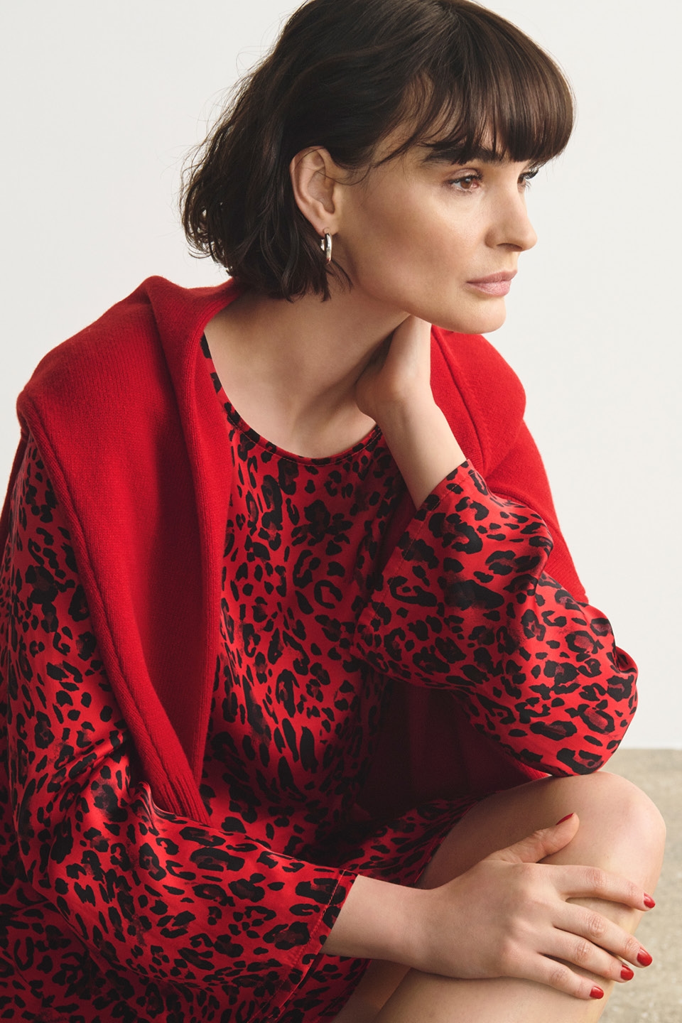 Woman in red dress with leopard print 